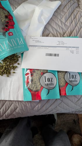 Customer's order of 1 Oz Cheap THCA Small Buds featuring several teal branded bags and an invoice.