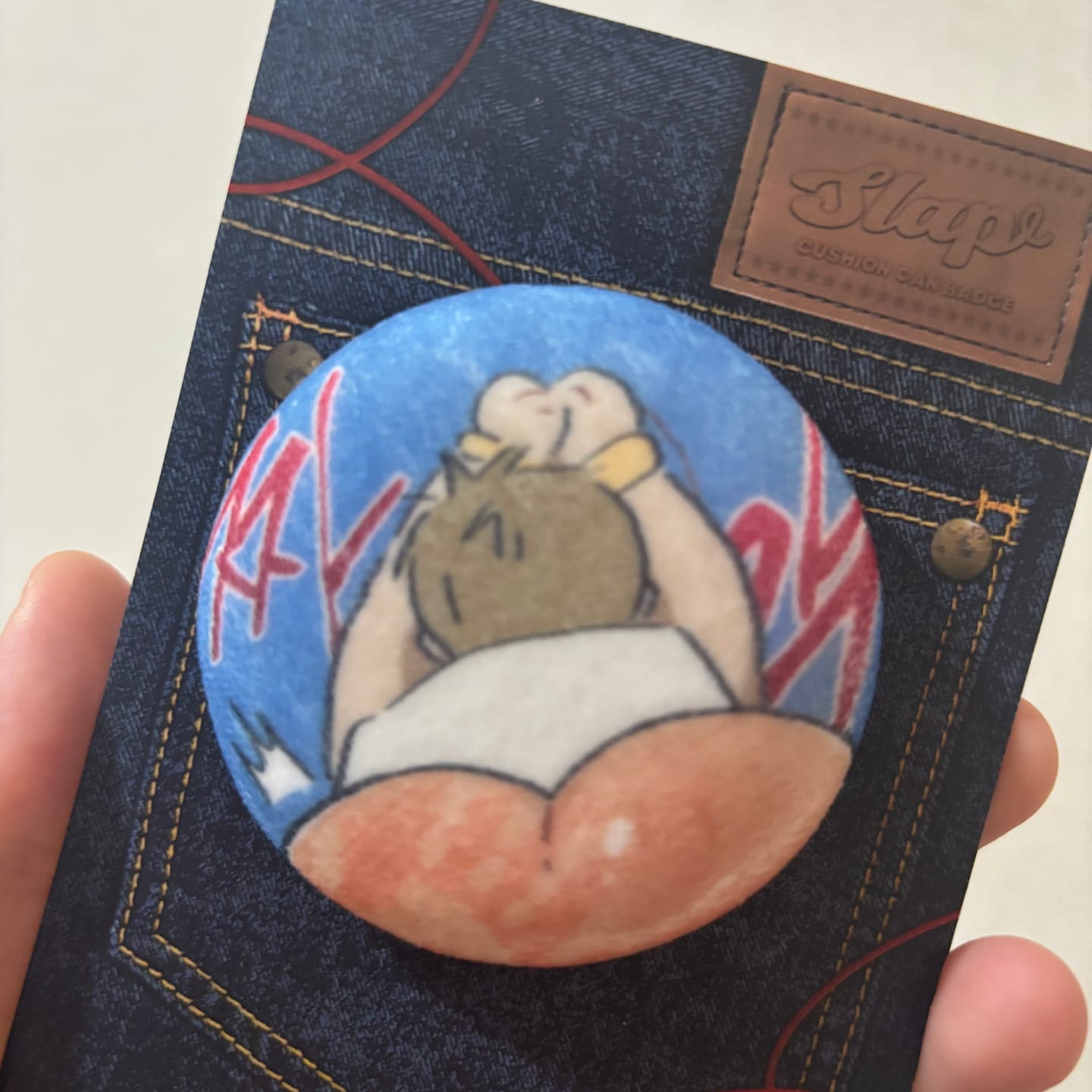 Customer photo review of Red Thread Quest - Slap Cushion Can Badge