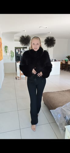 Customer wearing the black fashion slim-fit ski suit with faux fur jacket top and flared legs.