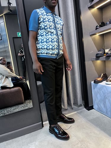 Customer's Lufiano Lace up shoes in black leather, being worn in a retail store.
