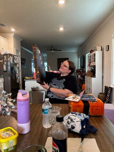 Customer's Autumn Witch portrait held up in a kitchen setting