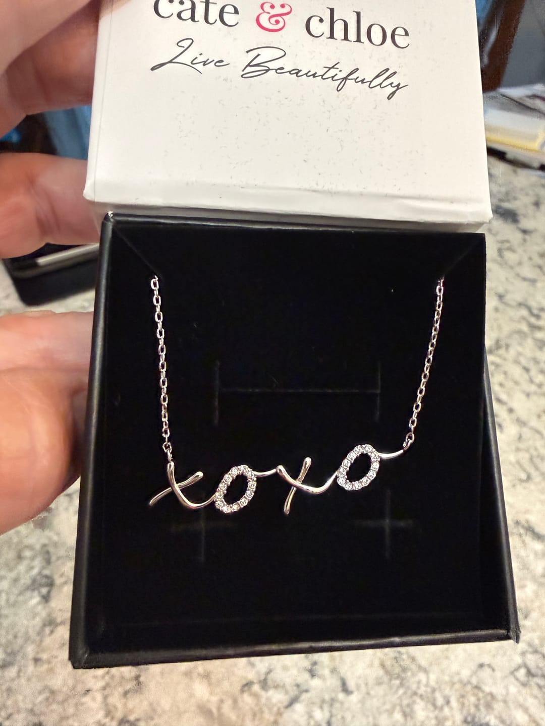 Customer photo review of Jocelyn 18k White Gold Plated XOXO Pendant Necklace with Swarovski Crystals