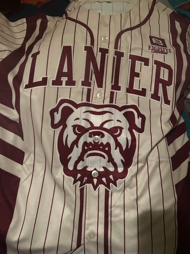 Customer's cream and navy pinstripe baseball jersey featuring the word LANIER and a bulldog graphic on the chest.
