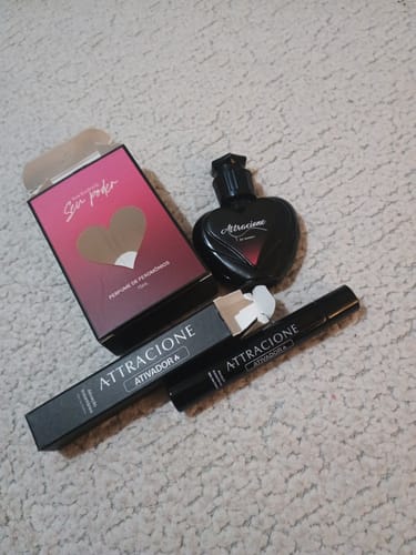 Customer's Attracione Sensual perfume kit with heart-shaped bottle, product box, and black tube.