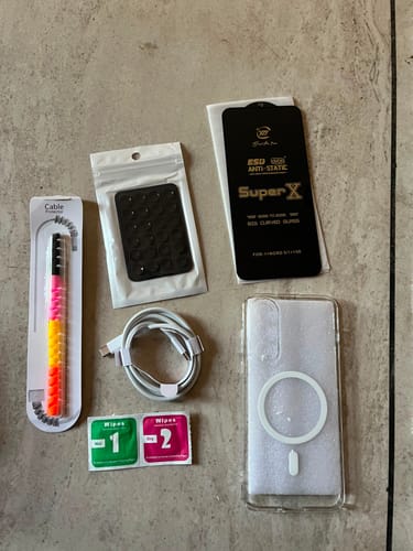 Customer's Casence Armor charging cable along with a smartphone case, screen protector, and various accessories.