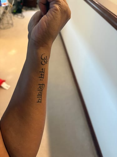 Faye’s custom tattoo design on her inner forearm