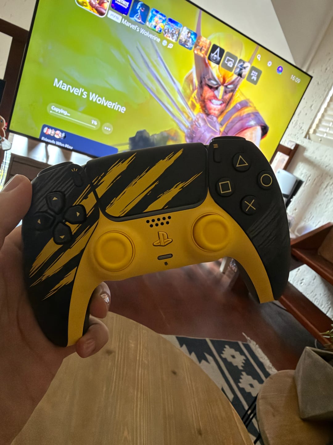 Customer photo review of PlayStation 5 (PS5) DualSense Wireless Controller - Marvel’s Wolverine Battle Yellow Limited Edition