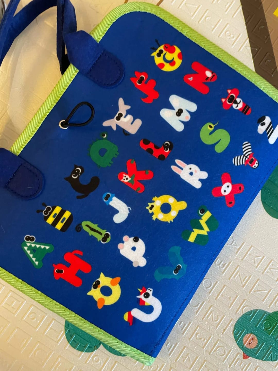 Customer photo review of TibaToes Busy Board — książeczka manipulacyjna