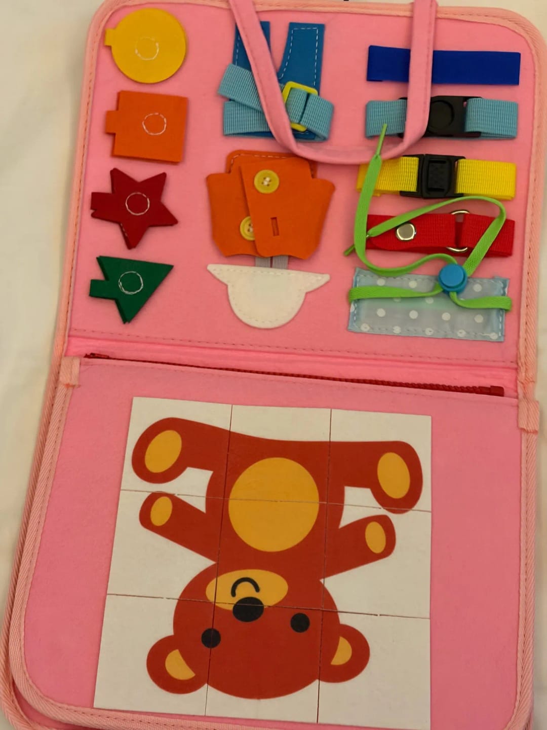 Customer photo review of TibaToes Busy Board — książeczka manipulacyjna