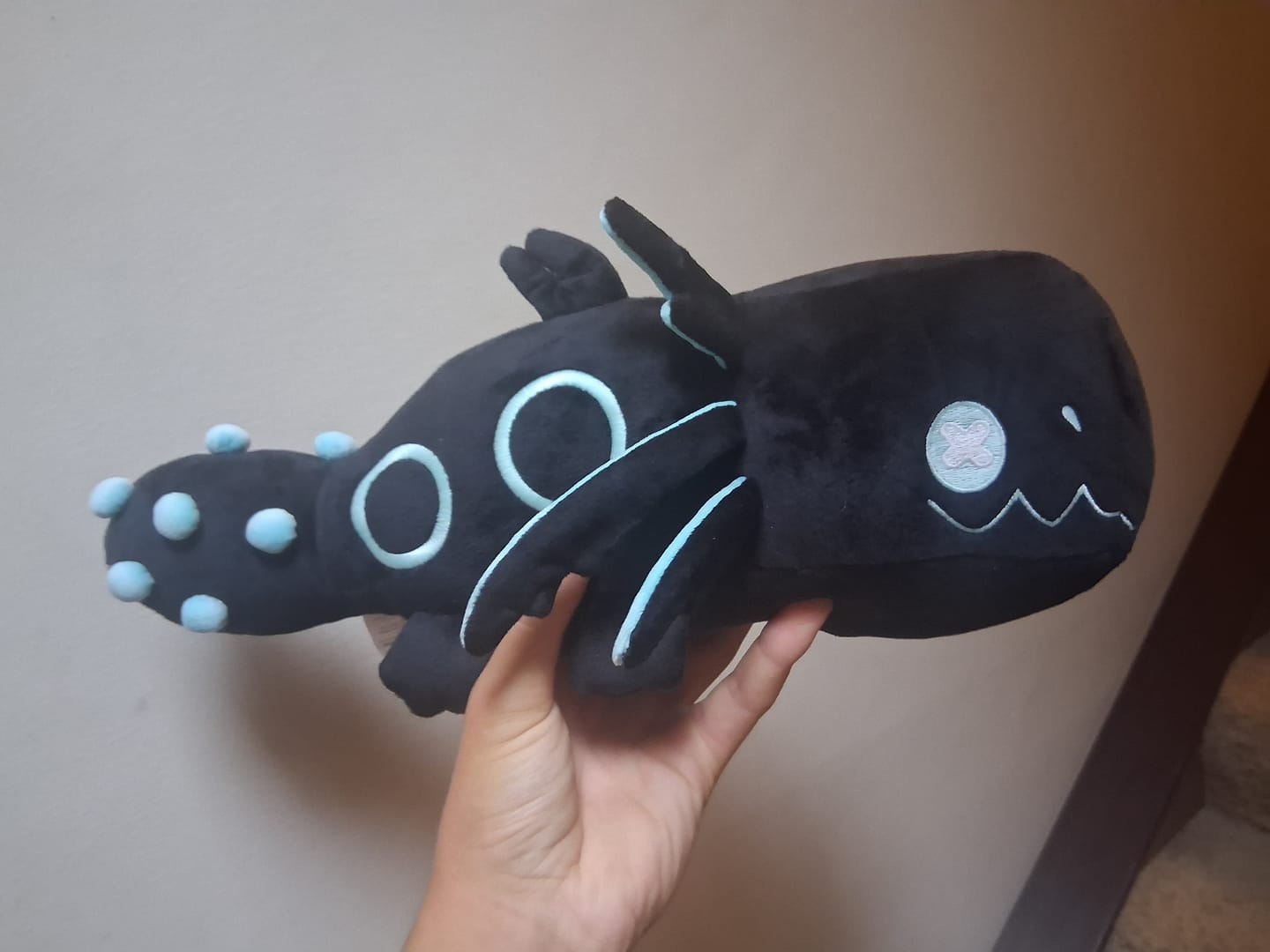 Customer photo review of Rain World - Glowing Cyan Lizard Plush