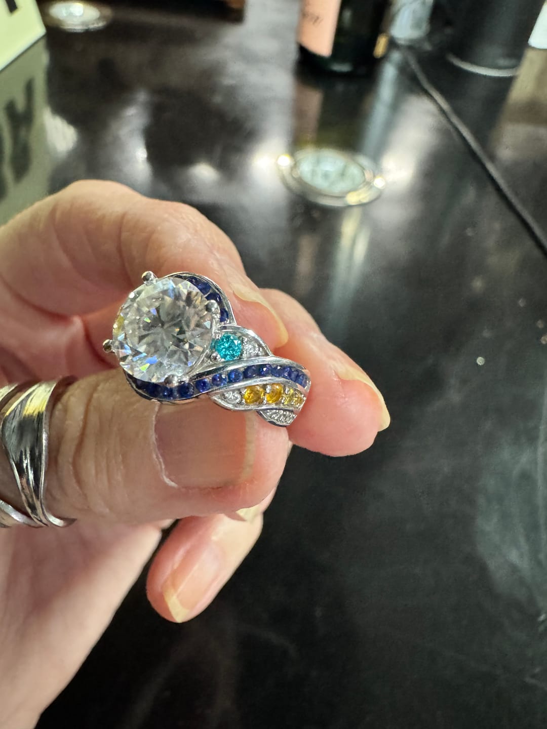 Customer photo review of Starry Night Moissanite Artistic Swirl Accent Engagement Ring