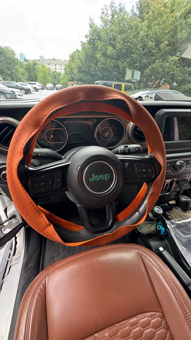 Customer photo review of Genuine Leather Embossed Braiding Steering Wheel Cover - Hand-Stitched Anti-Slip Car Decoration Accessory
