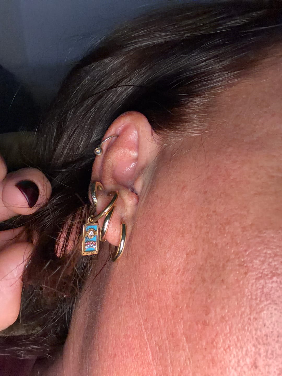 Customer photo review of The Sun - Tarot Card Hoop Earrings