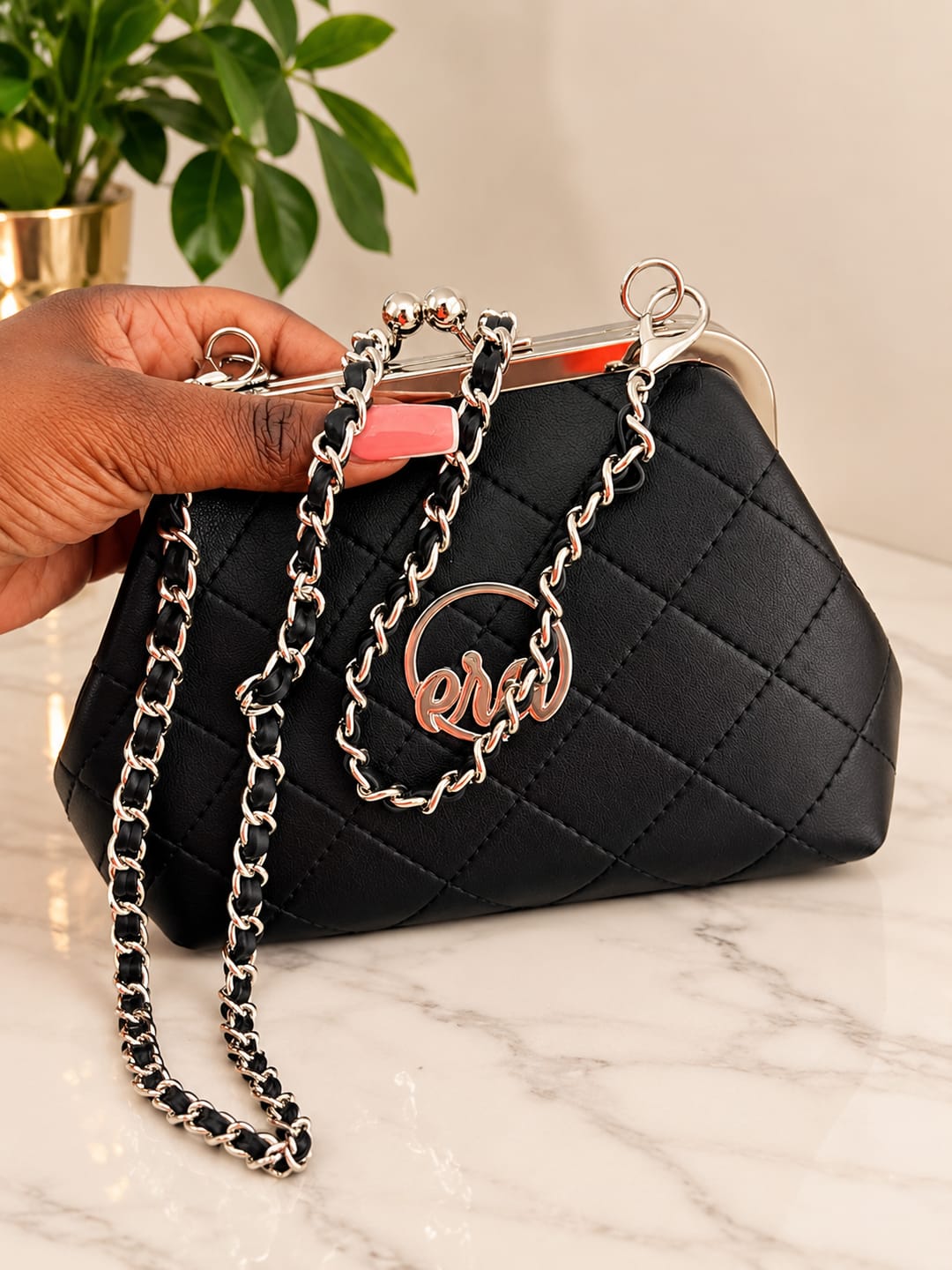 Customer photo review of ERA Mini Kisslock Chain Bag – Black