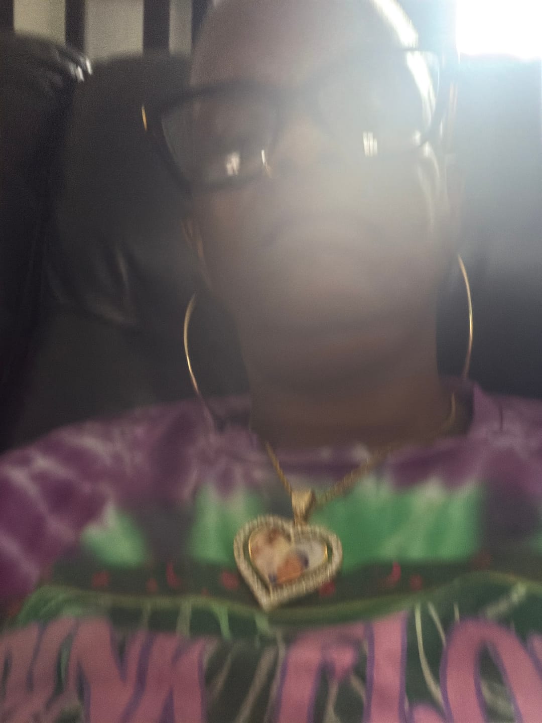 Customer photo review of Iced Heart Spinning Photo Pendant