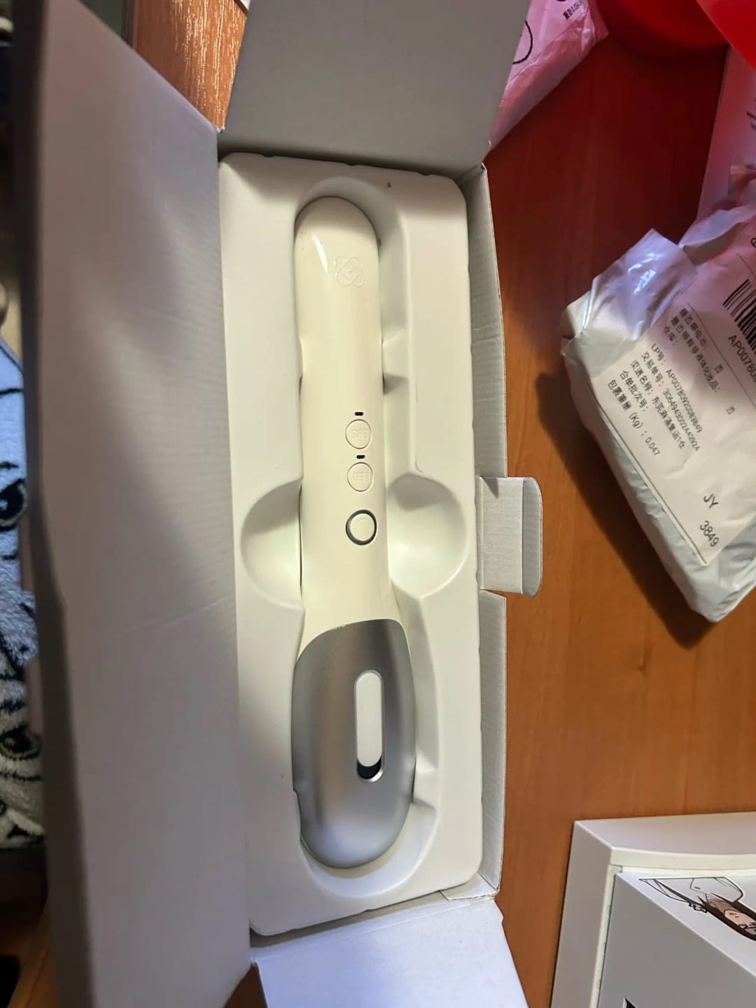 Customer photo review of Deluxe Electric Massage Comb with Oil Dispenser - Sonic Scalp Massager