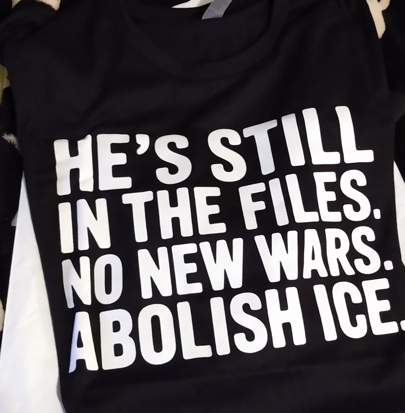 Customer photo review of He's Still in the Files. No New Wars. Abolish ICE Unisex Long Sleeved Tee