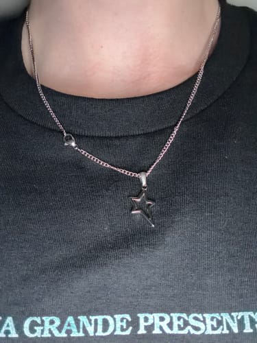 Customer's Starpoint Pendant on a silver chain worn around their neck.