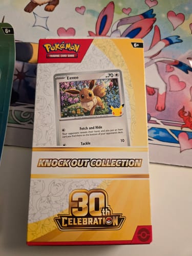 Customer's Pokemon 30th Celebration Knock Out Collection box, showing the included Eevee foil card on the packaging.