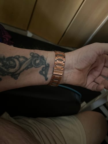 Customer's Mens Copper Magnetic Bracelet on their wrist, showing the copper links and sturdy construction.