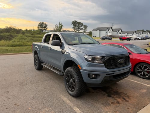 Customer's gray Ford Ranger with installed wheel spacers parked in a lot, showcasing a wider truck stance.