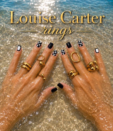 Customer's hands wearing gold Birdie Stack Rings in water