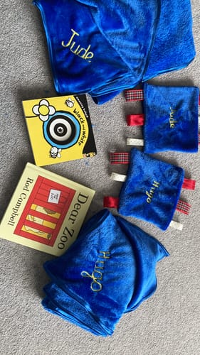 Customer's bright blue Plain Cuddle Fleece Fabric made into two personalised blankets and two small sensory toys.