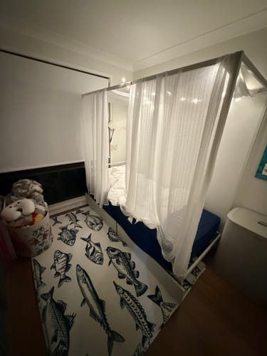 Customer's Mellow Mat v2 Kid's Bedroom Edition with a black and white fish pattern, placed in a child's bedroom.
