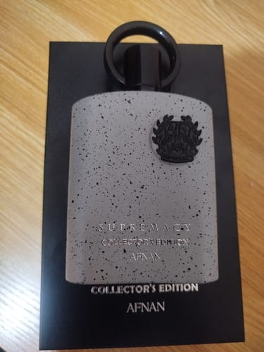Customer's Afnan Supremacy Collector's Edition perfume bottle with a speckled grey finish and black cap.