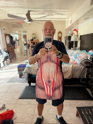 Reviewer wearing a Funny 3D Hairy Body BBQ Personalized Apron while taking a mirror selfie.