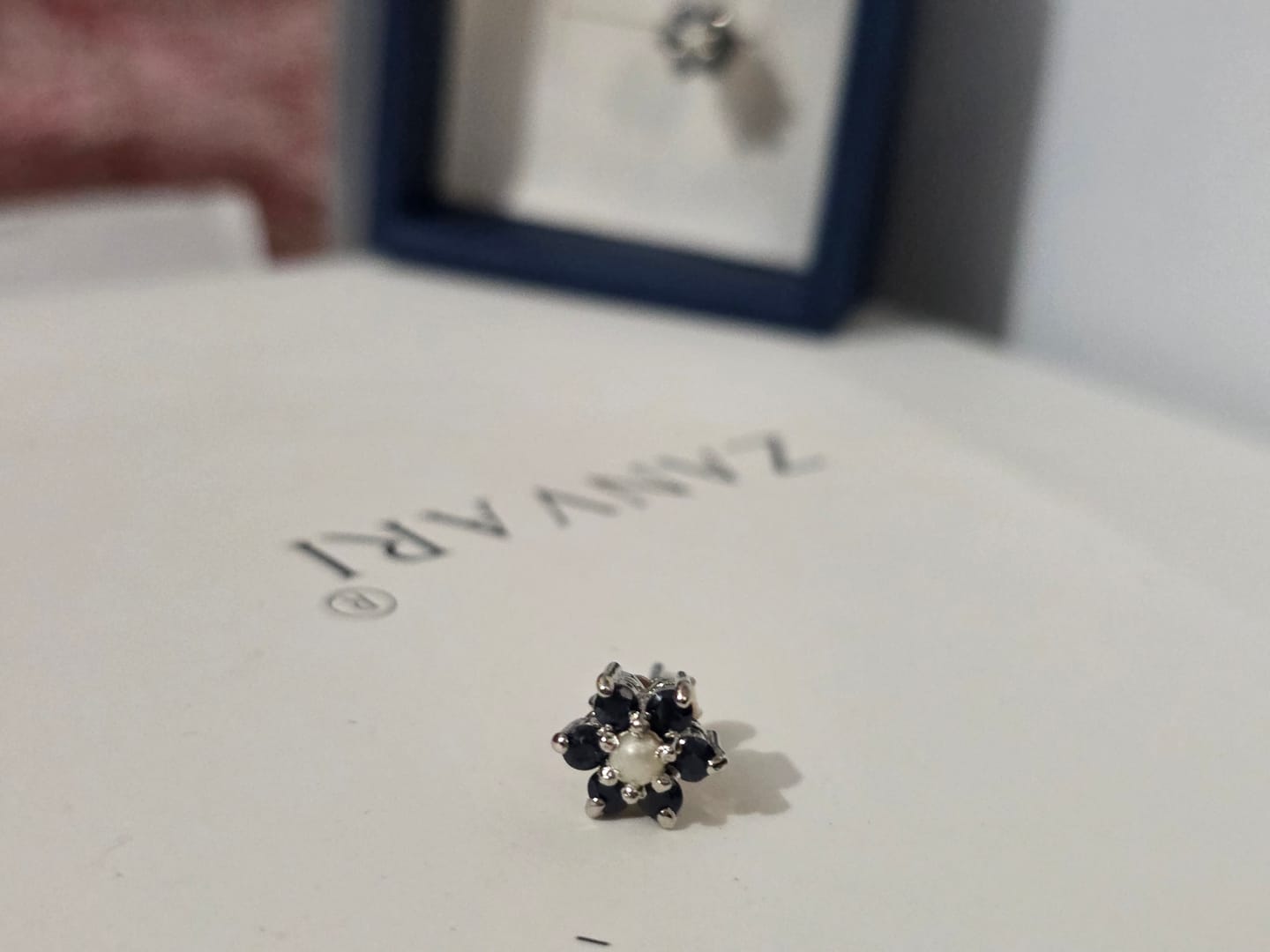 Customer photo review of Symbol of Heaven — Natural Sapphire & Pearl Studs in Sterling Silver