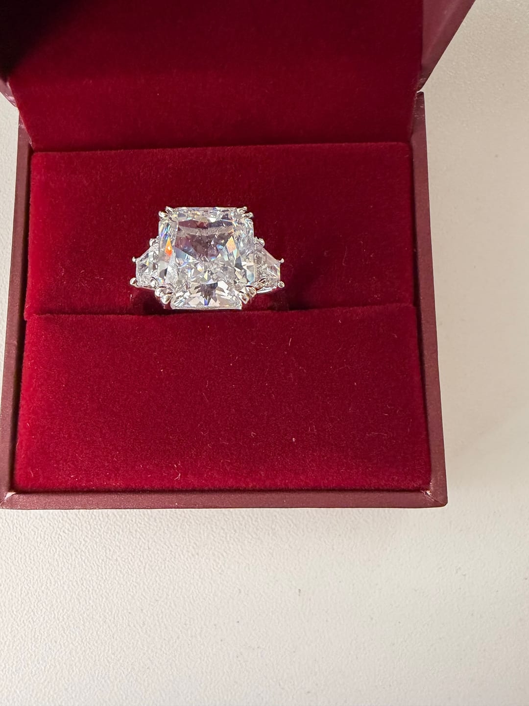 Customer photo review of S925 6.5/12.0 Ct Radiant Cut Crushed Ice Simulated Diamond Three-Stone Engagement Travel Ring