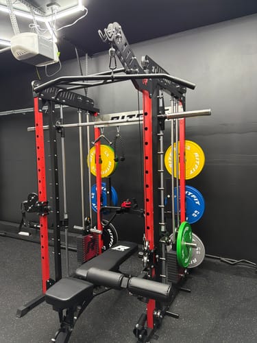 Customer's RitFit LPM1 Lat Pulldown attachment installed on a red and black metal power rack in a home gym.