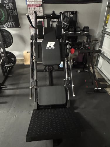 Customer's black RitFit Leg Press machine positioned on a home gym floor in a garage setting.