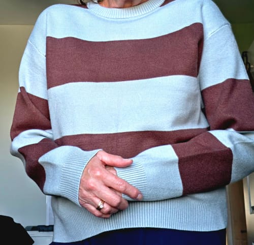 Reviewer's Be Cool Charlie Soft Knit Sweater with muted blue and brown stripes, worn in a relaxed fit.