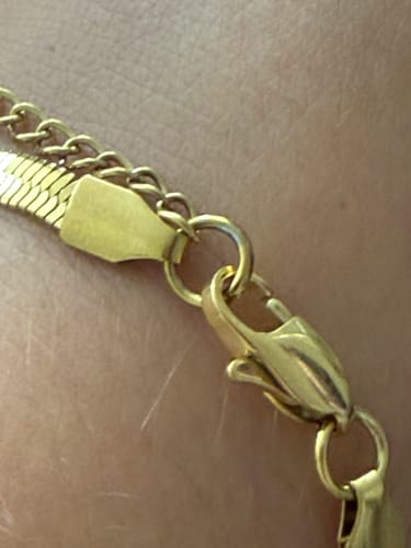 Customer's close-up of the gold Angelica Stainless Steel Herringbone Bracelet clasp showing slight tarnishing.