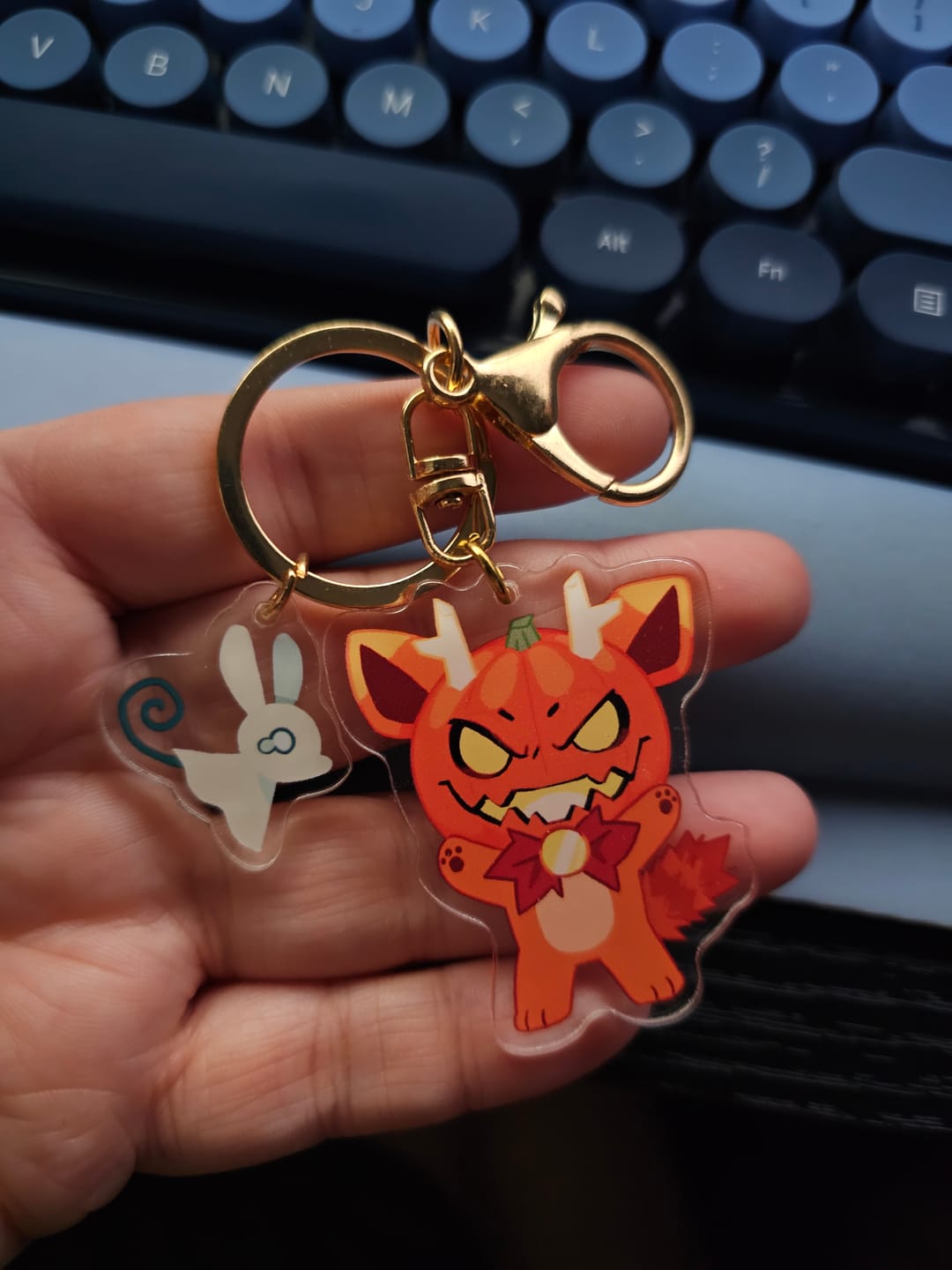 Customer photo review of Spoopy Double Sided Acrylic Keychain