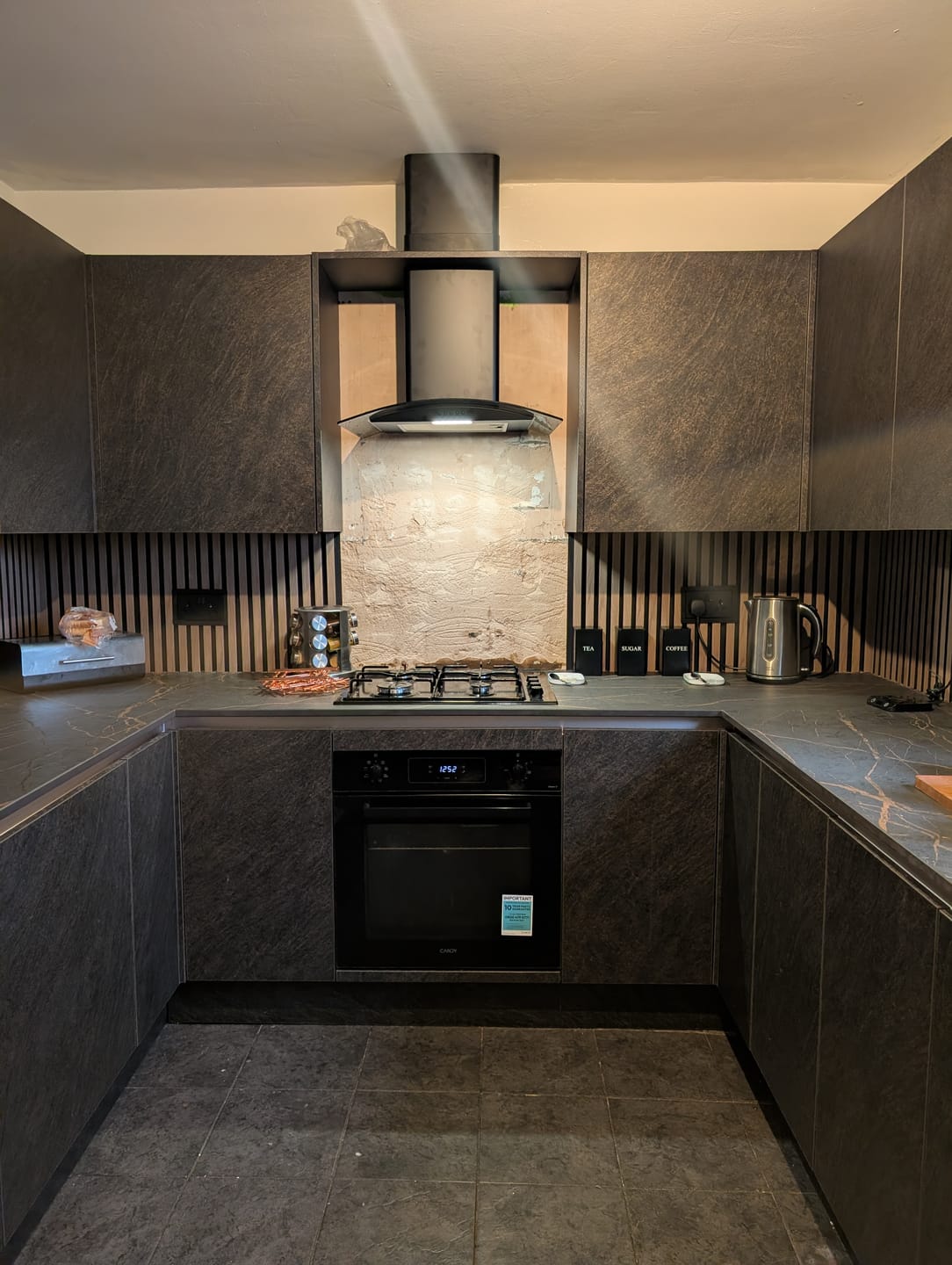 Customer photo review of SlatWall Waterproof Walnut and Black Wall Panel