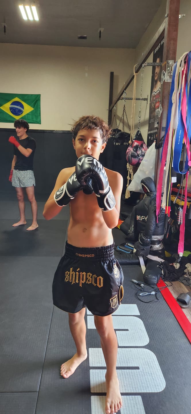 Customer photo review of Deep Waters II Black and Gold Muay Thai Shorts