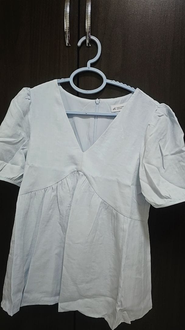 Customer photo review of V-Neck Short Sleeve Flowy Babydoll Blouse