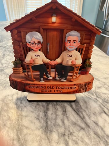 Customer's Eternal Love Couple wooden plaque, showing two characters named Kim and Ted sitting in a cabin.
