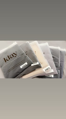 Customer's shipment of several packaged Premium Modal hijabs in various neutral shades.
