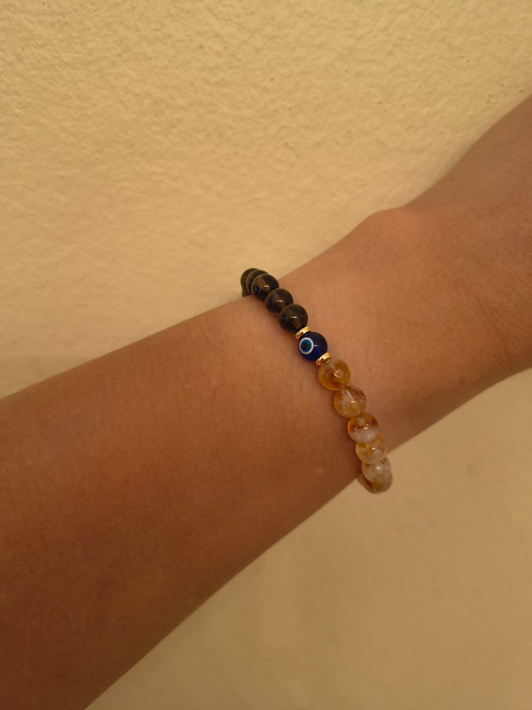 Customer photo review of Evil Eye Abundance Reset Smoky Quartz and Citrine Bracelet
