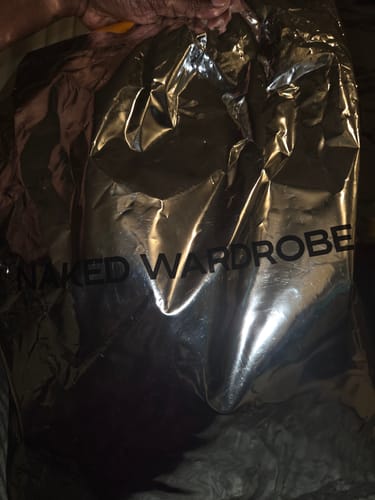 Customer's shiny silver packaging for the Linen Tube Maxi Dress at arrival.