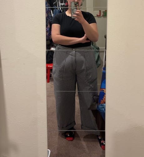 Customer's Ripstop Construction Pants in a black and white checkered pattern, worn with a black t-shirt.