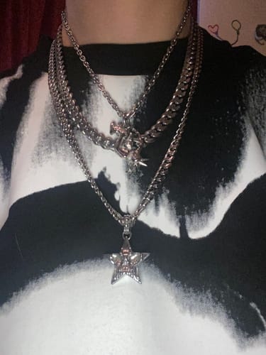 Customer's worn FREE UNRELEASED JEWELRY pieces, including silver star and other pendants on layered silver chains.