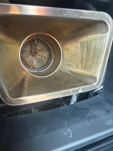 Customer's RPM Pro R spark arrestor insert installed inside the muffler, showing the metallic mesh quiet core.