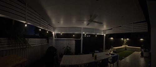 Customer's Litehouse Solar Bulb String Lights glowing at night installed on an outdoor patio