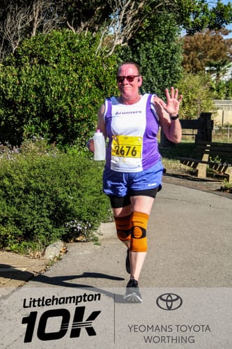 Reviewer's RUNNR 2-in-1 Running Shorts, worn during a 10k road race, showing athletic fit.