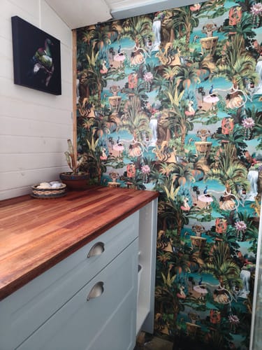 Customer photo review of Sunset Carnival – Seaside Scene Wallpaper – Multi
